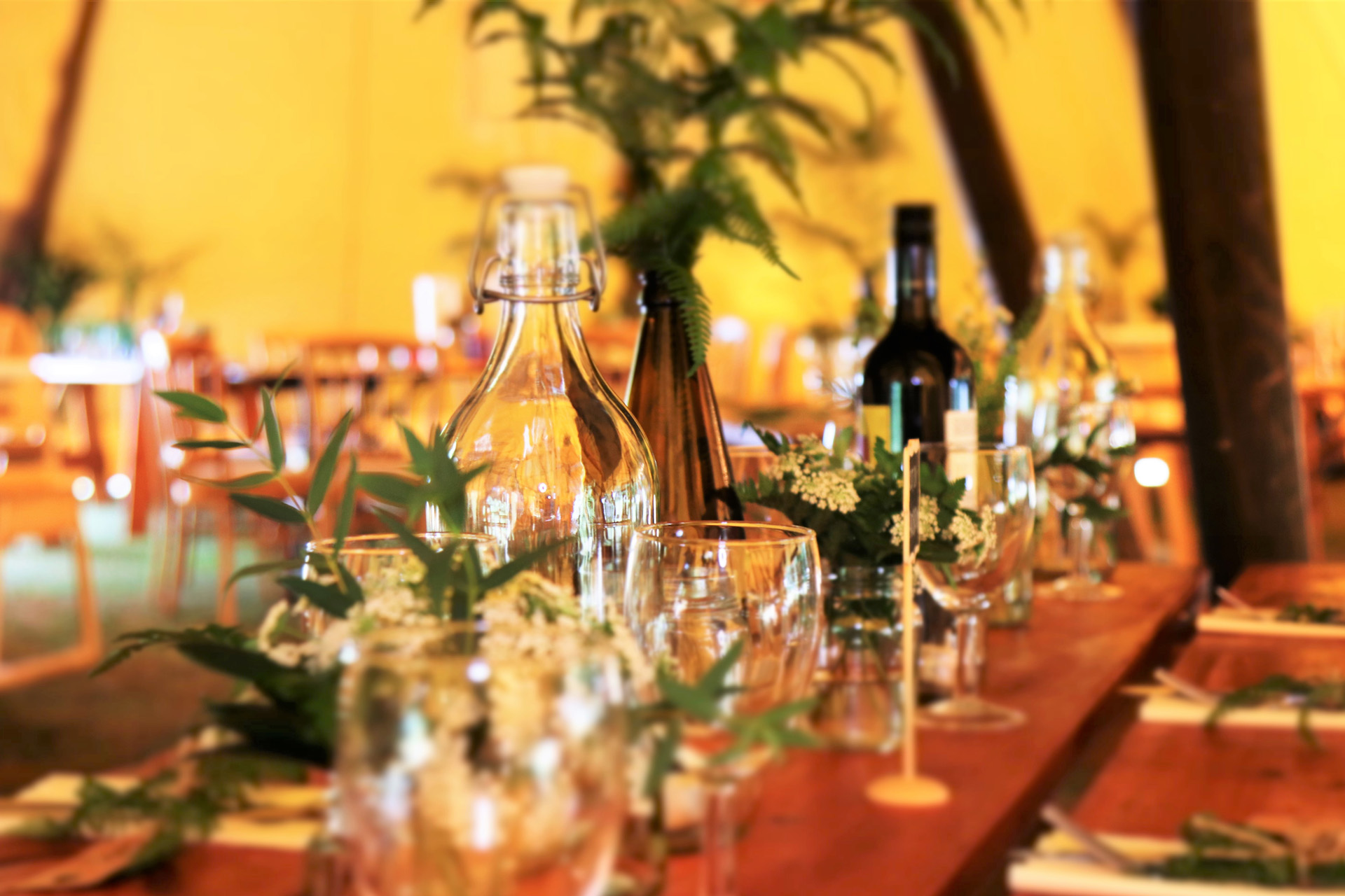 dinner table set with glasses and plates