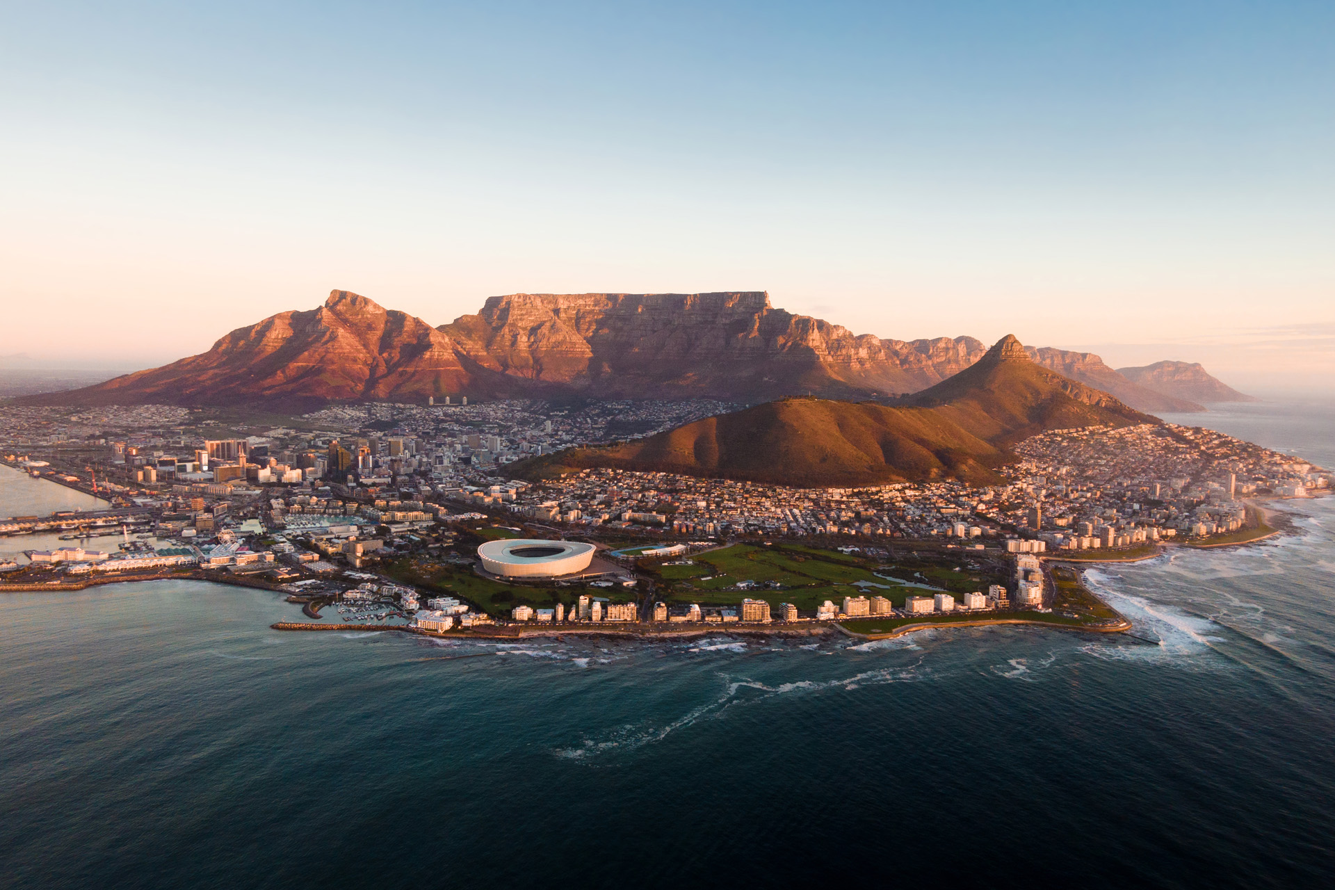 Aerial view of Cape Town cityscape at sunset, Western Cape Province, South Africa.