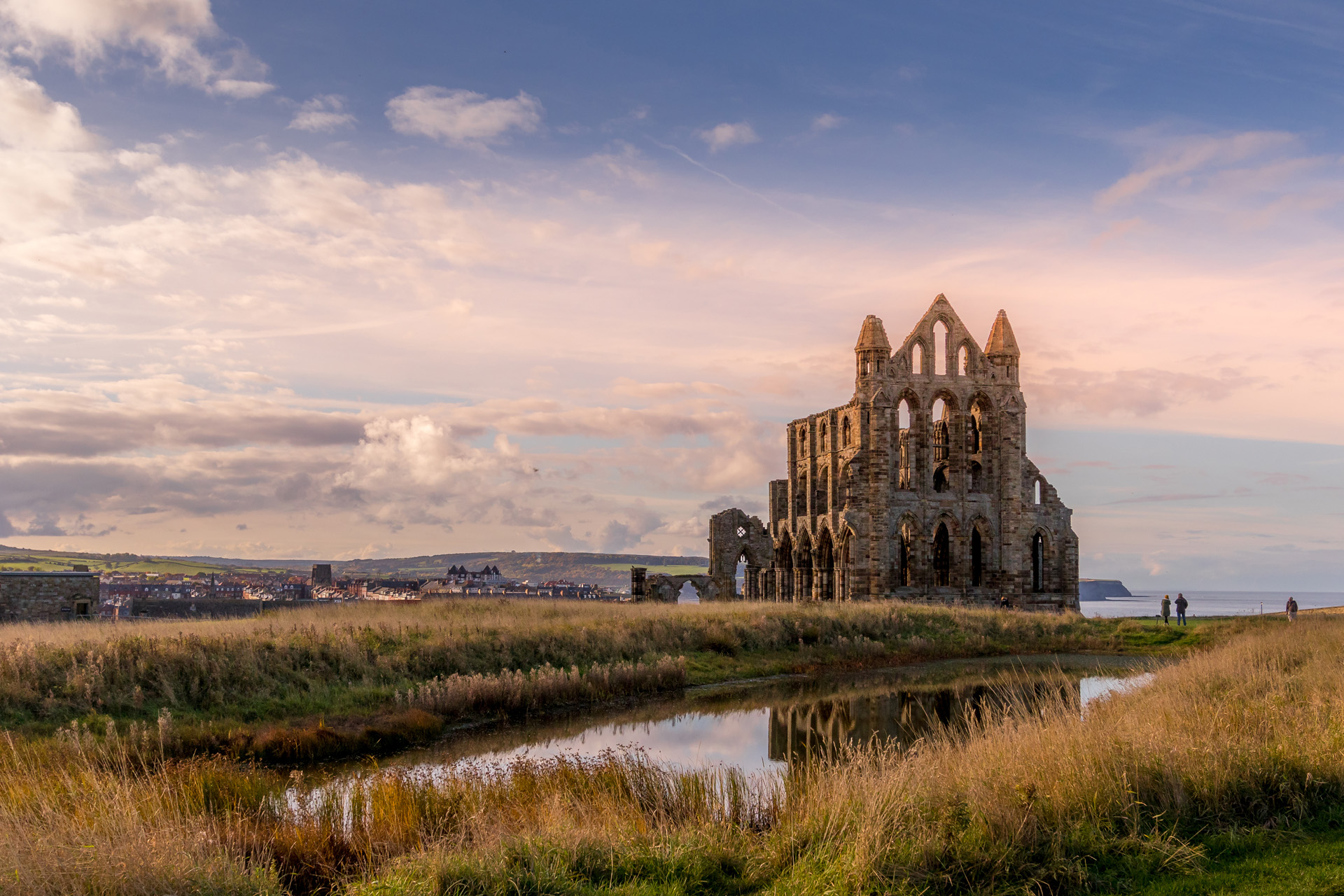 Whitby Abbey at dusk overlooking the North Sea on the East Cliff above Whitby in North Yorkshire, England.