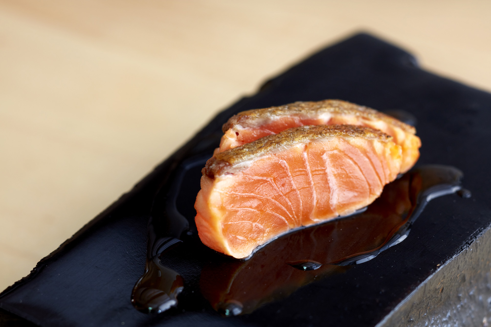 trout on a black dish