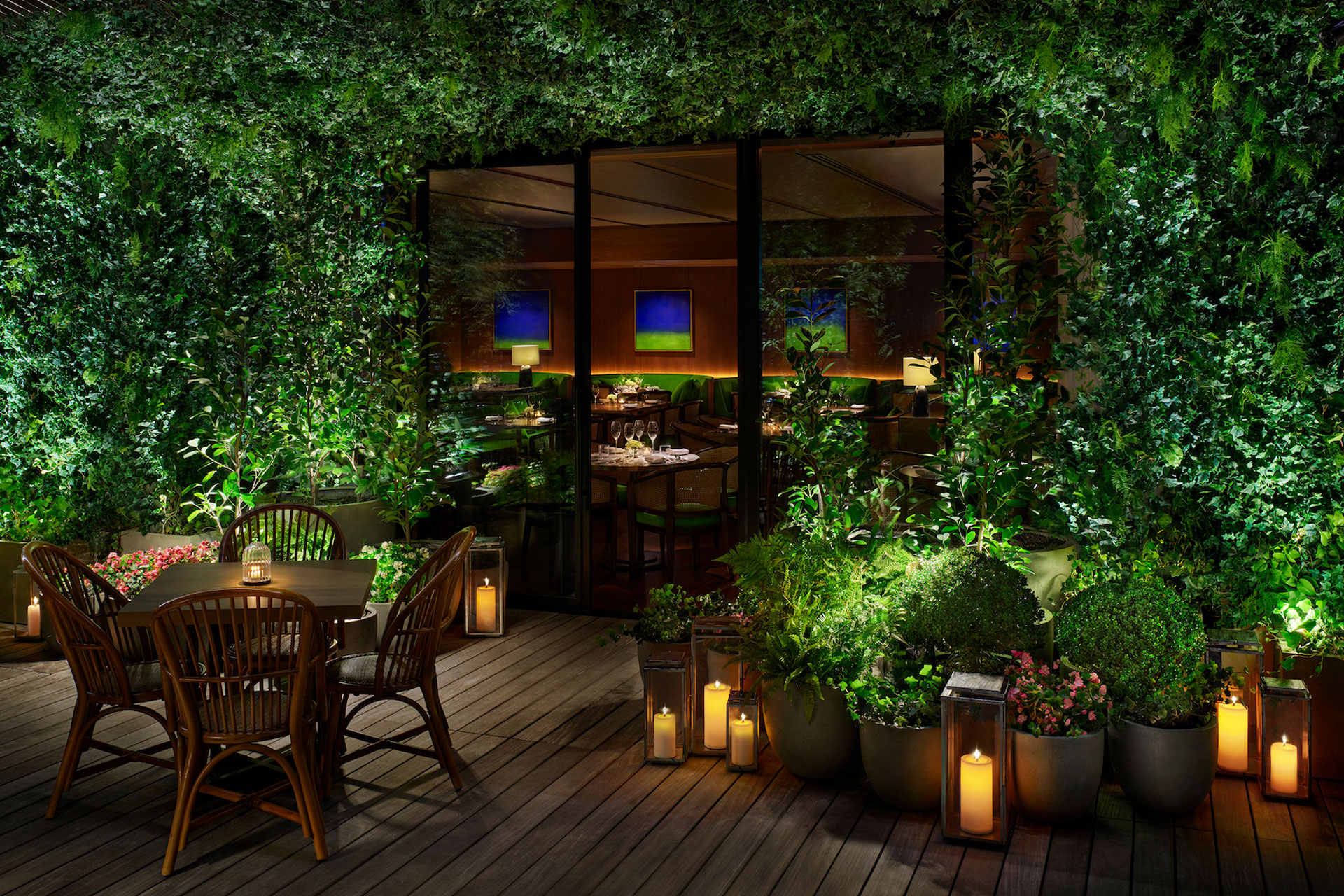 Restaurant balcony with greenery and candles