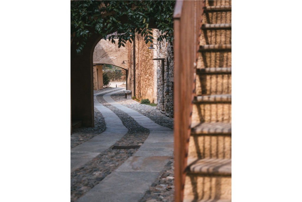 a small path with archway and stairs