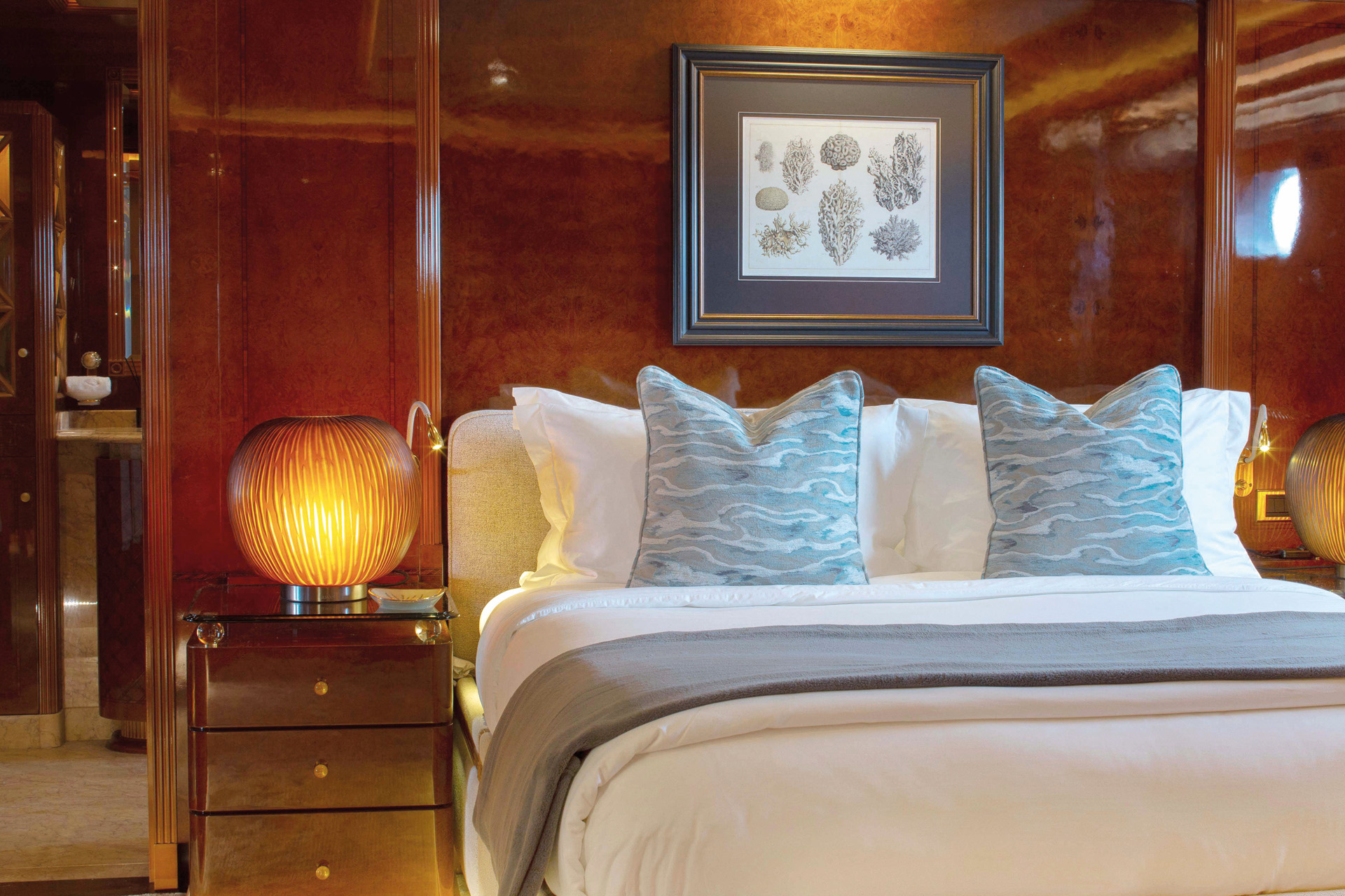 a bed in a wood panelled cabin room