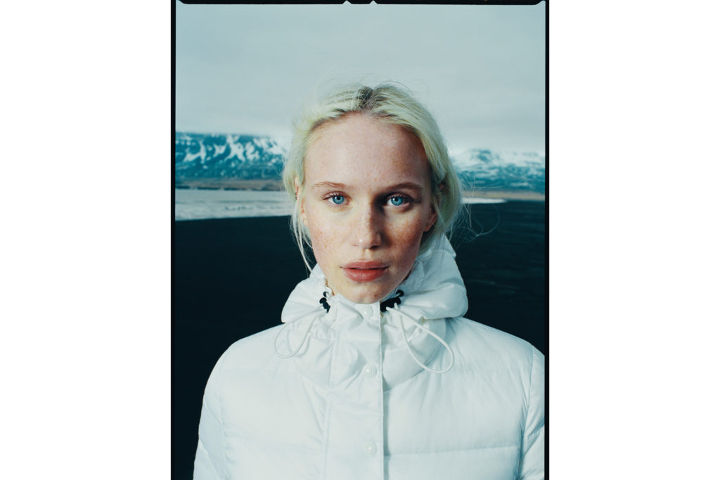 a blonde woman wearing the BELSTAFF Scooter coat,