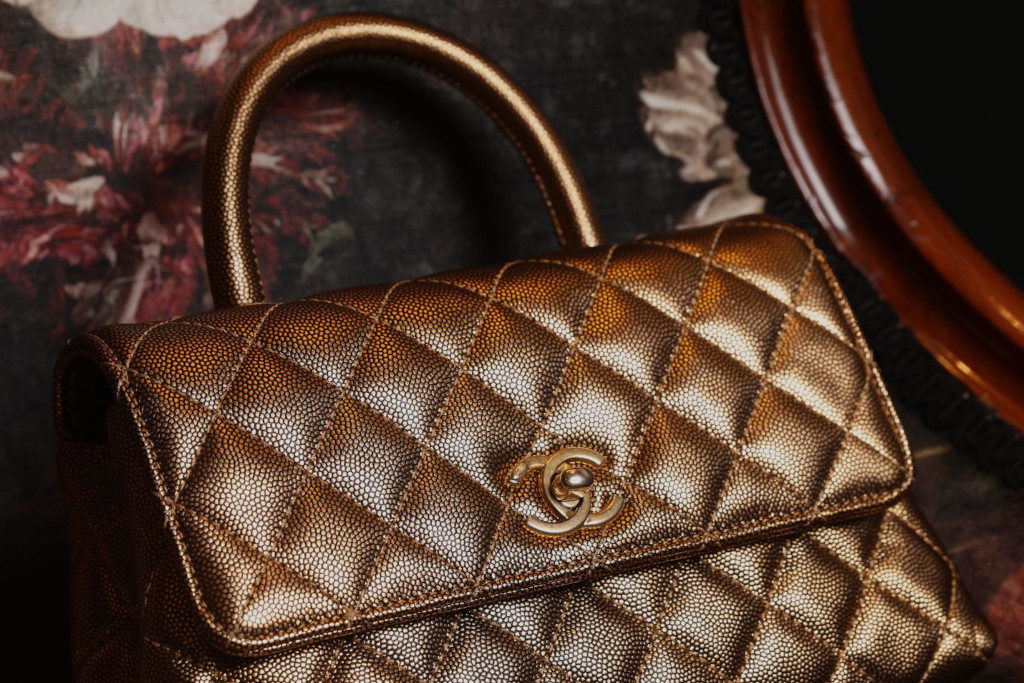 Close up of gold Chanel bag