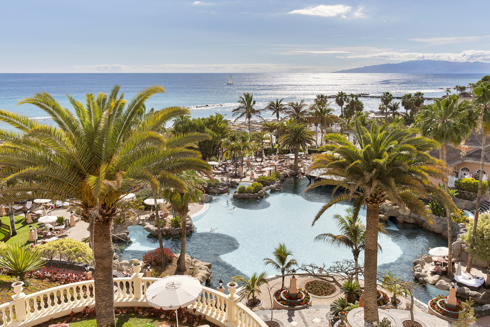 a shot of Bahía del Duque from above, with lots of palm trees