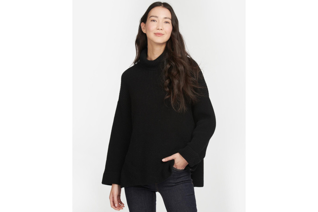 Woman in black knit jumper