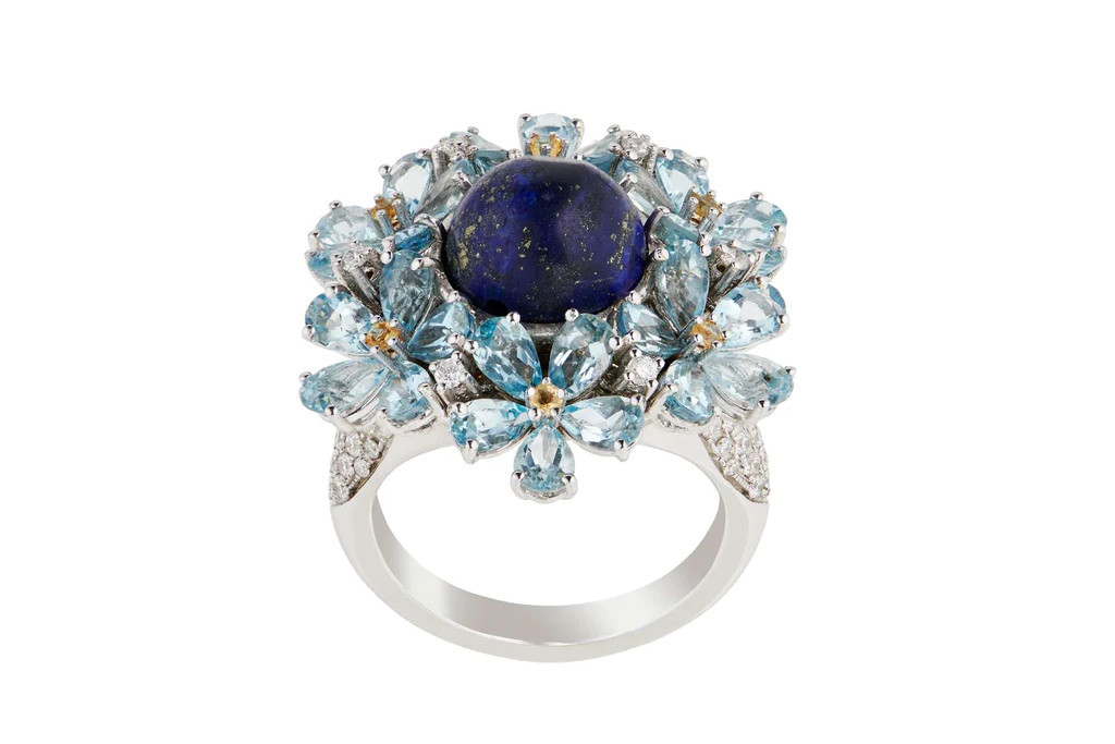 Silver ring with blue flowers and blue stone