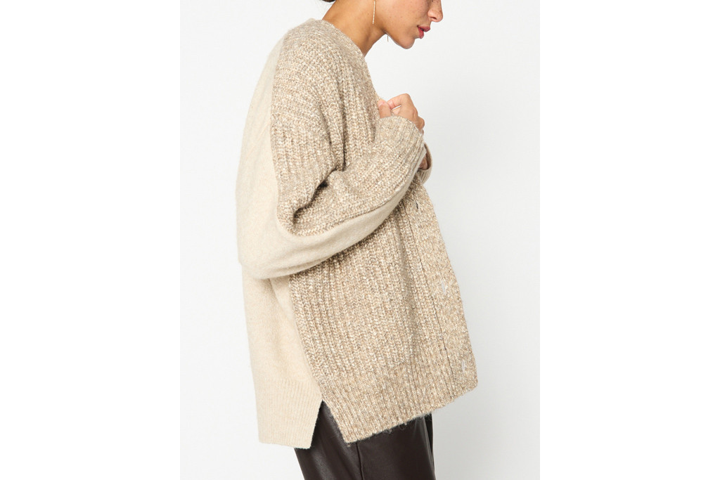 Close up of woman in neutral colour jumper
