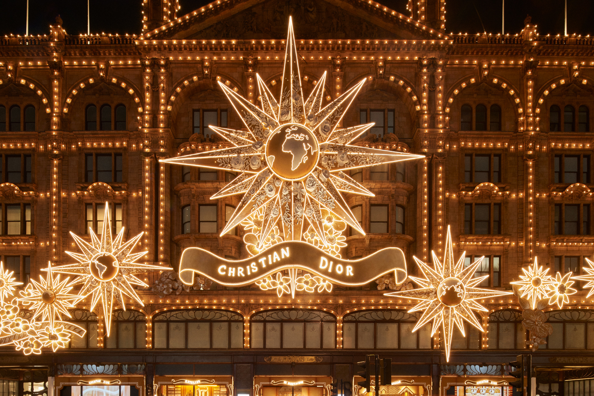 Harrods facade lit up for Christmas with Dior theme