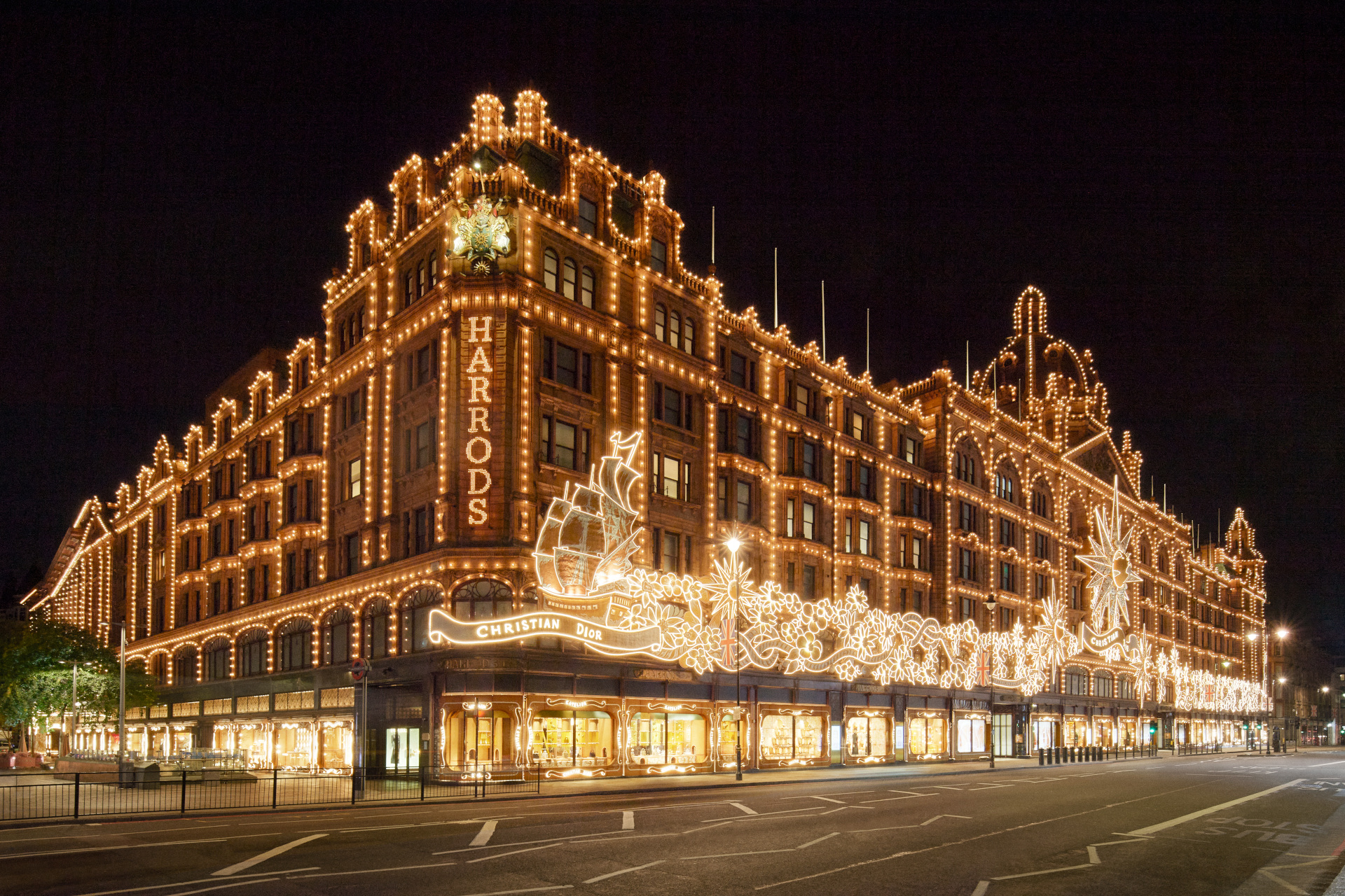 Harrods facade lit up for Christmas with Dior theme