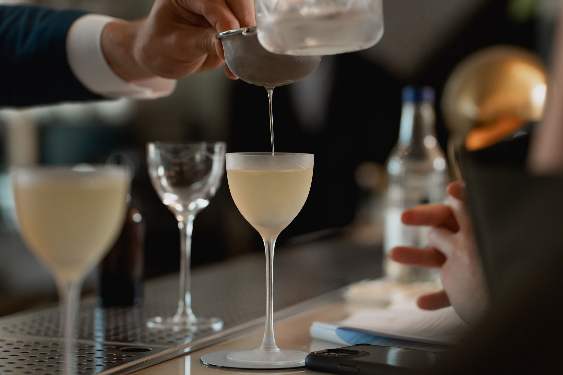 martini being made by bartender