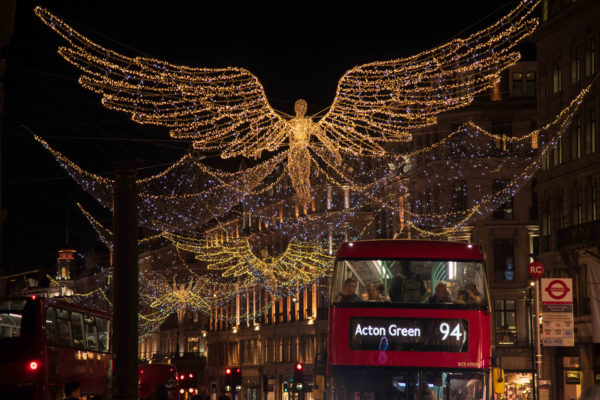 London, United Kingdom - November 12, 2022: Red double decker bus on Regents Street with Christmas Lights