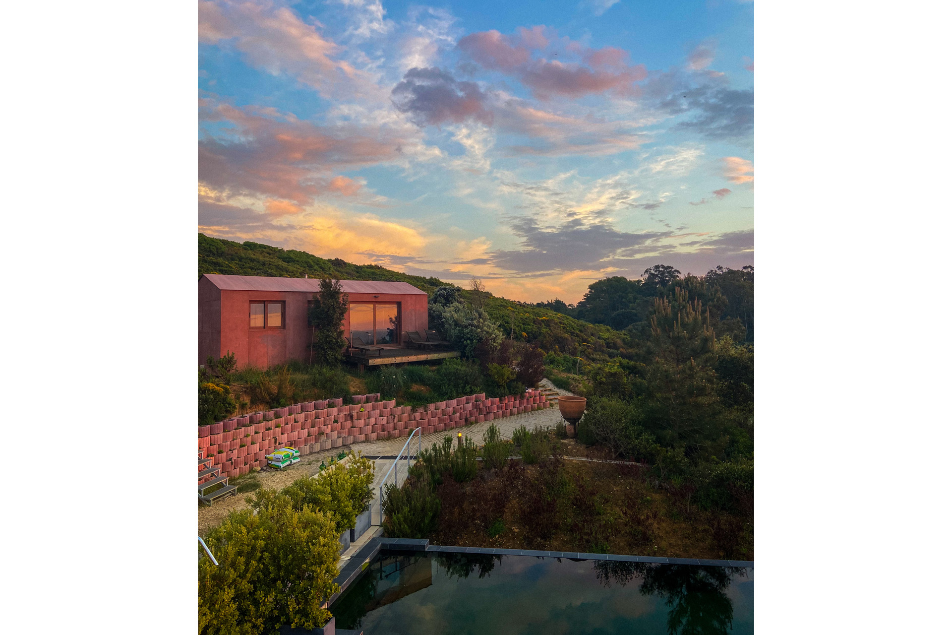 Villa Epicurea at dusk with a pink glow