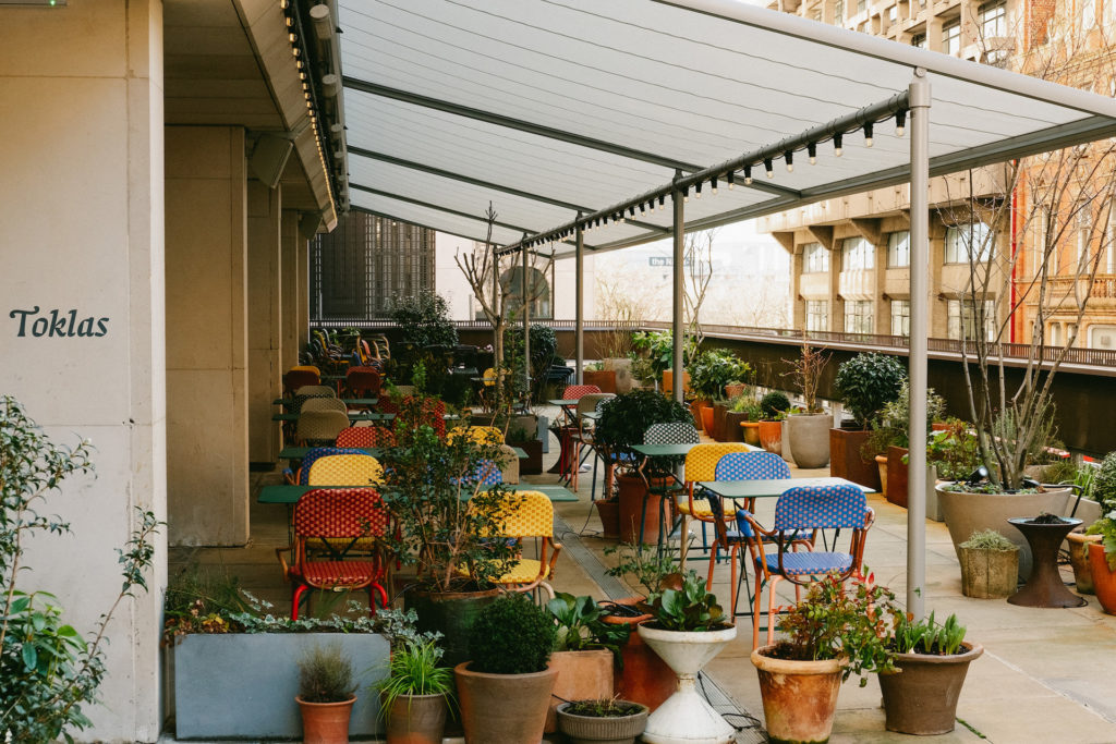 our outdoor terrace with colourful chairs and plants