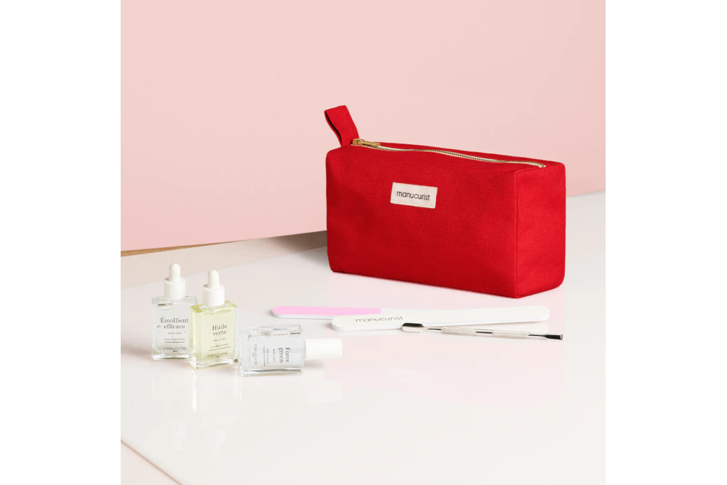 Red ouch with nail products on pink background