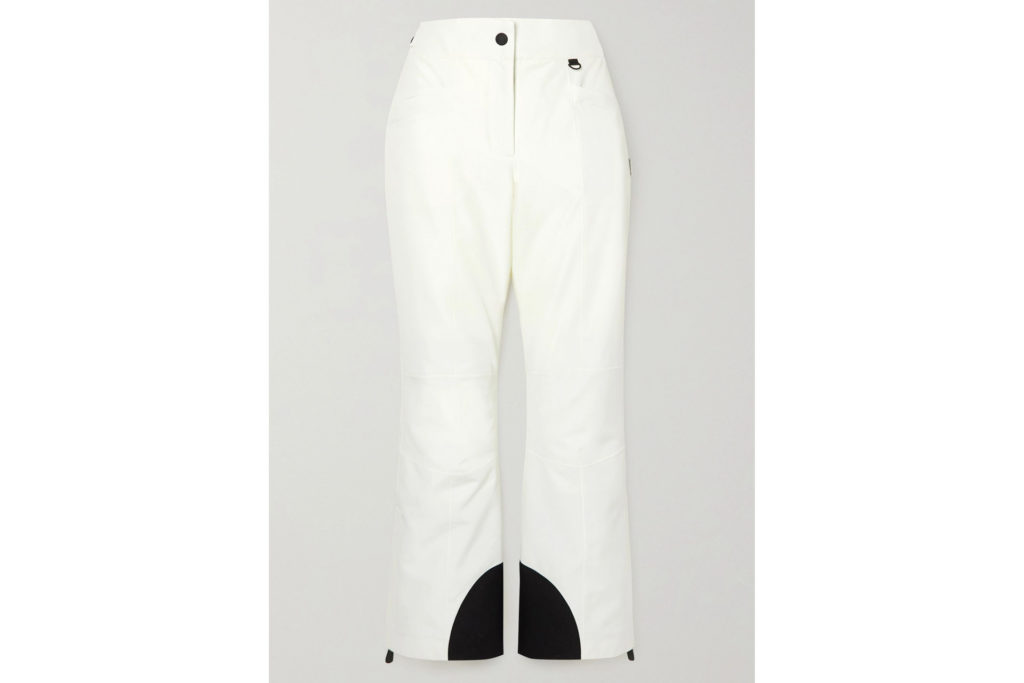 white ski pants with black design at the bottom