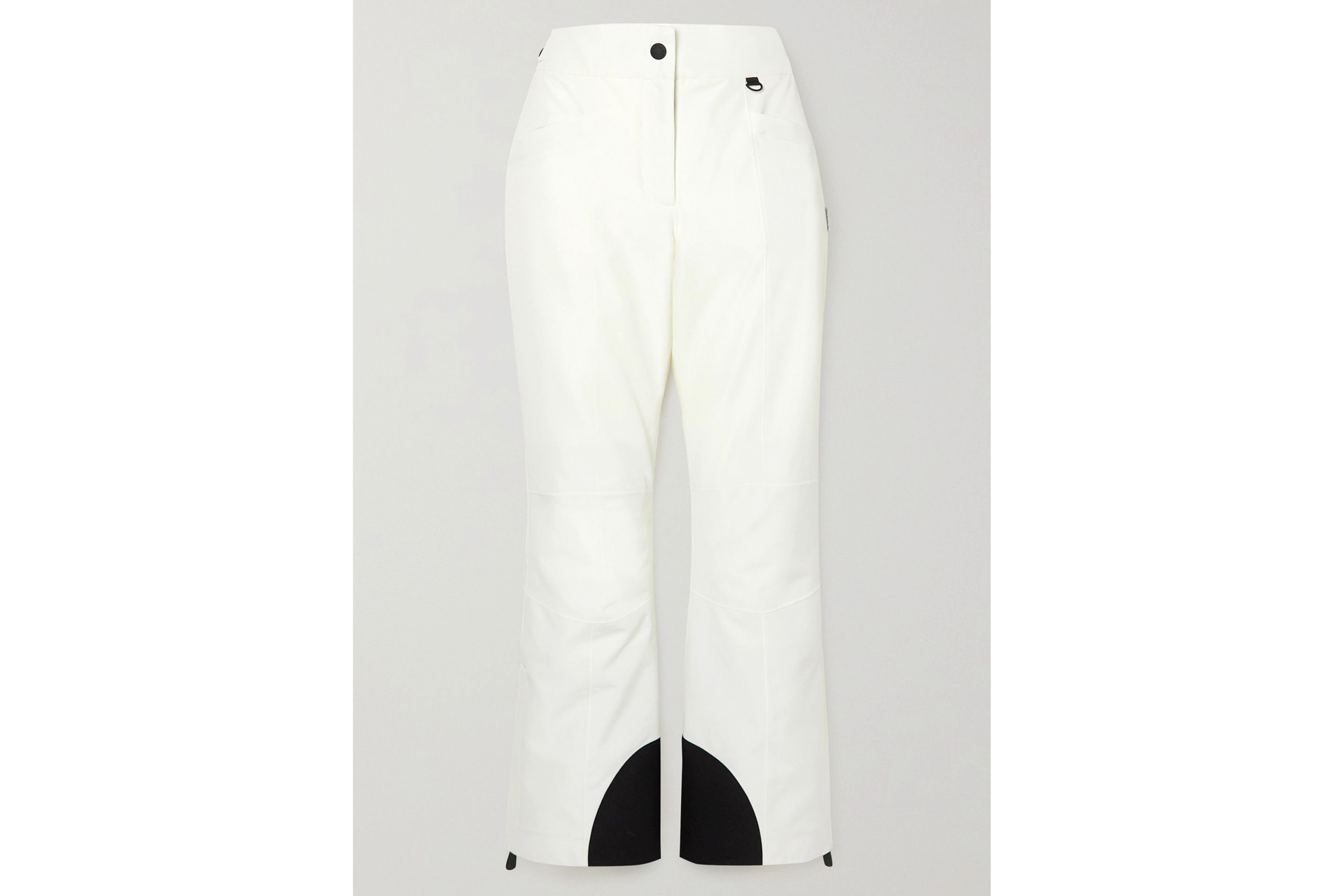 white ski pants with black design at the bottom