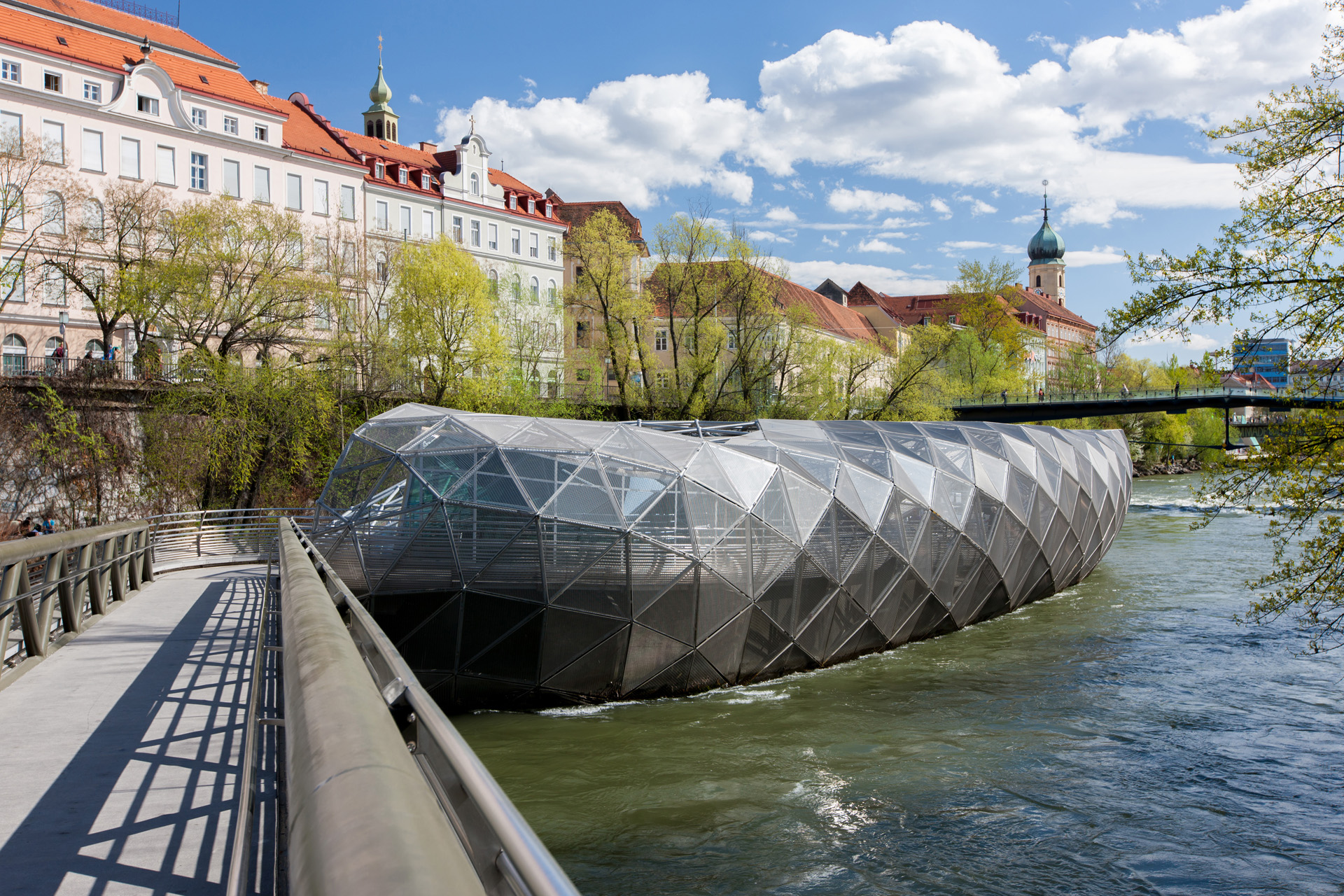 a modern bridge over water in graz