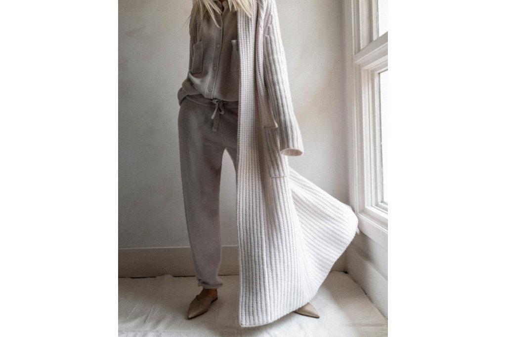 Close up of woman in long grey cardigan
