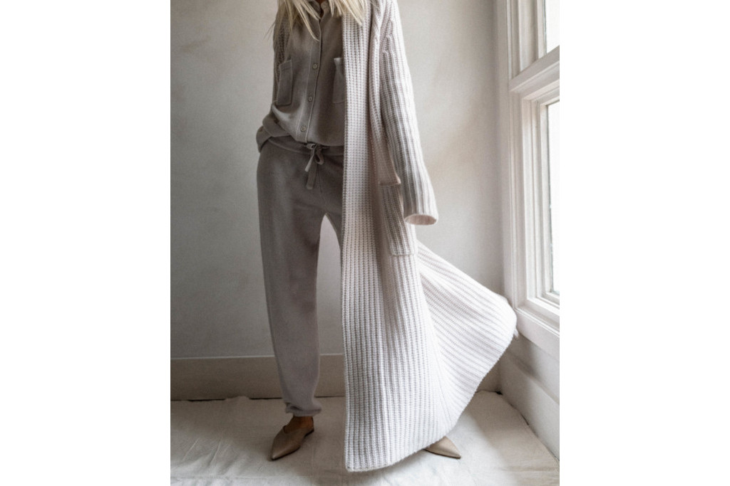 Close up of woman in long grey cardigan