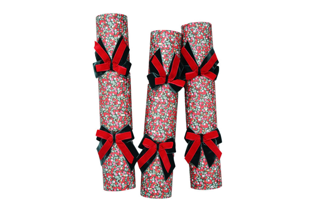 Three floral patterned crackers with red ribbons