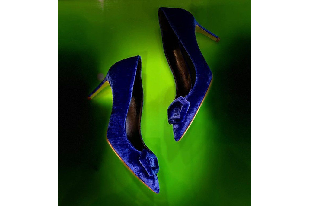 Blue heels on green background