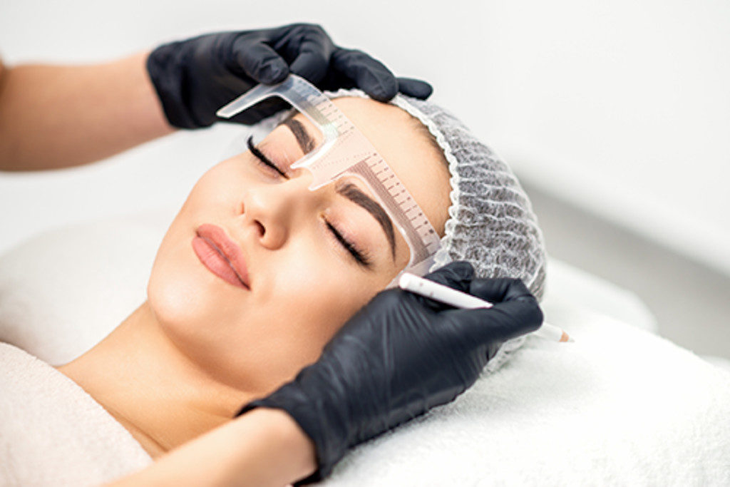 Woman getting her brows done