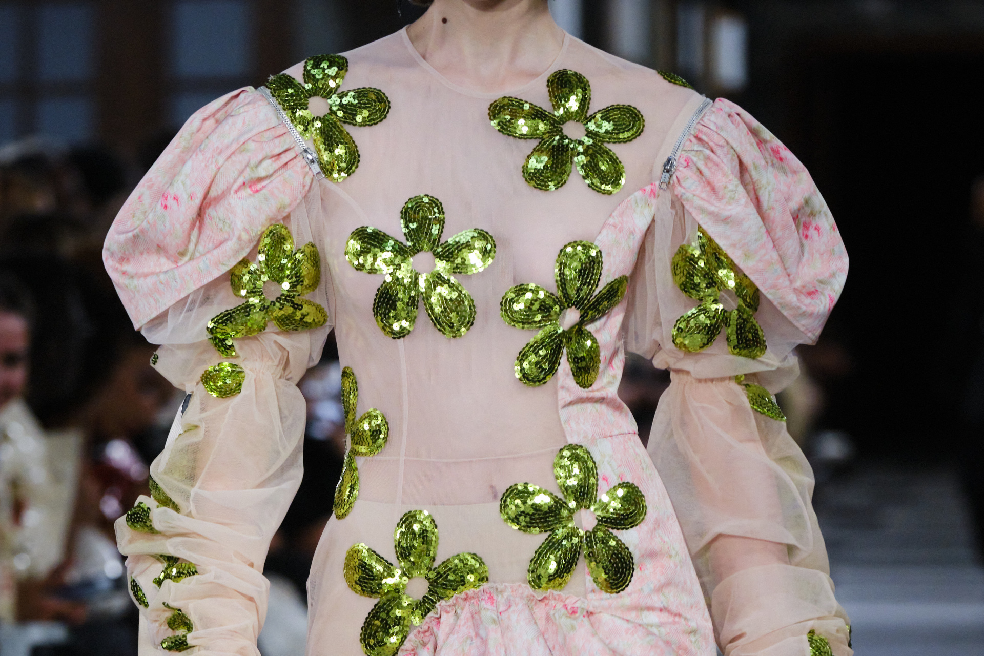 Close up of pink puff sleeve dress with green flowers