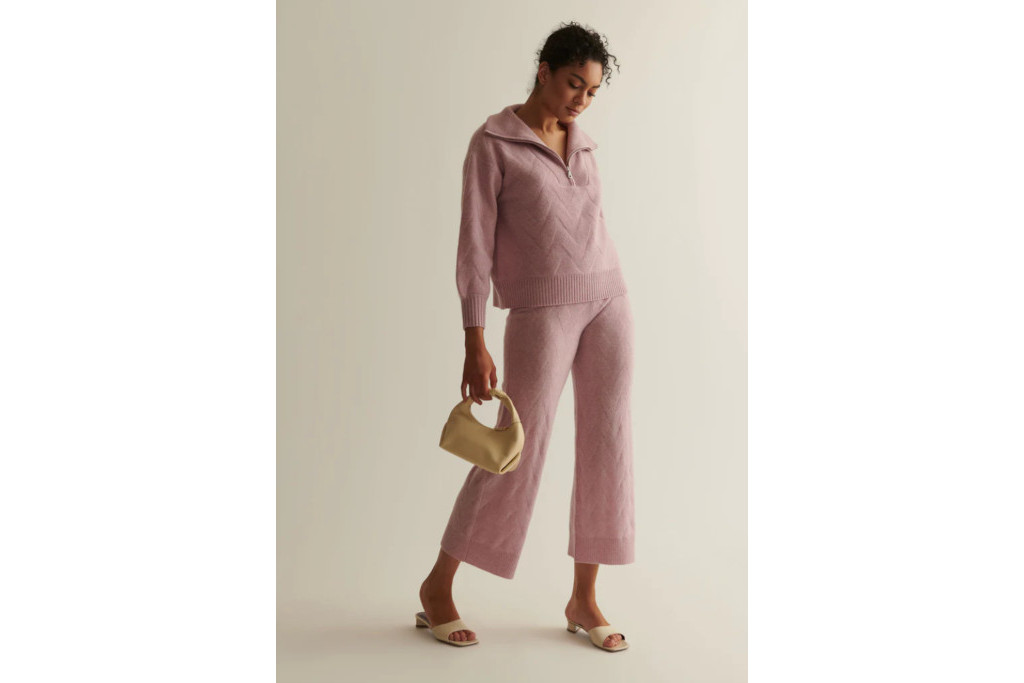 Woman in pink jumper and trousers