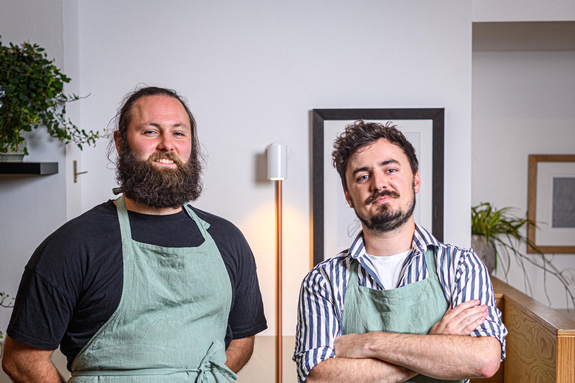 a sommelier and a chef standing side by side