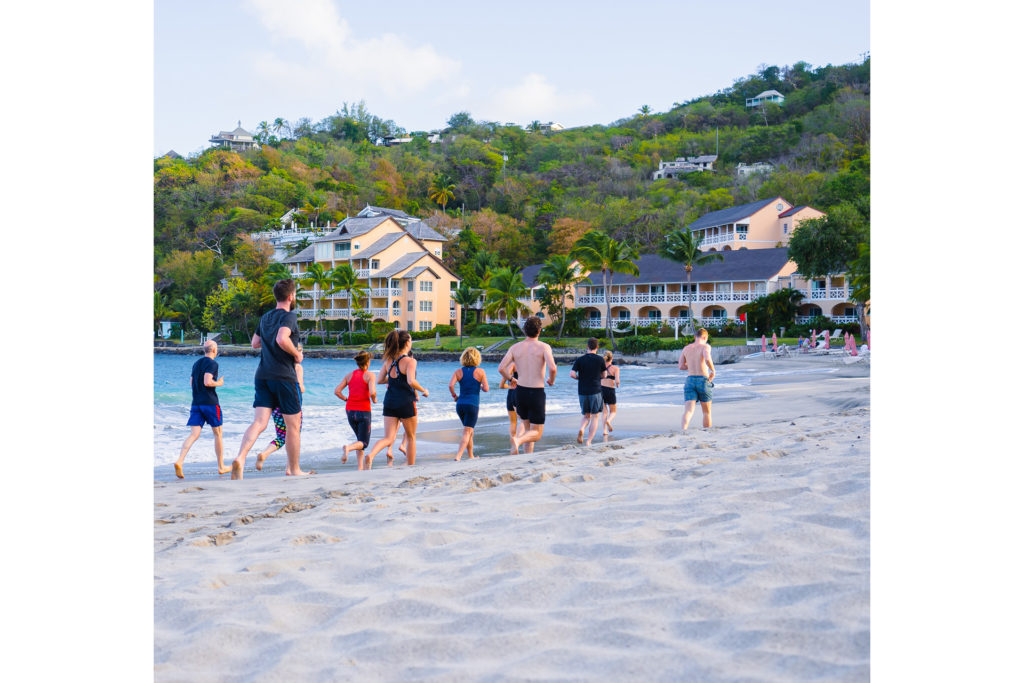 people running on the beach