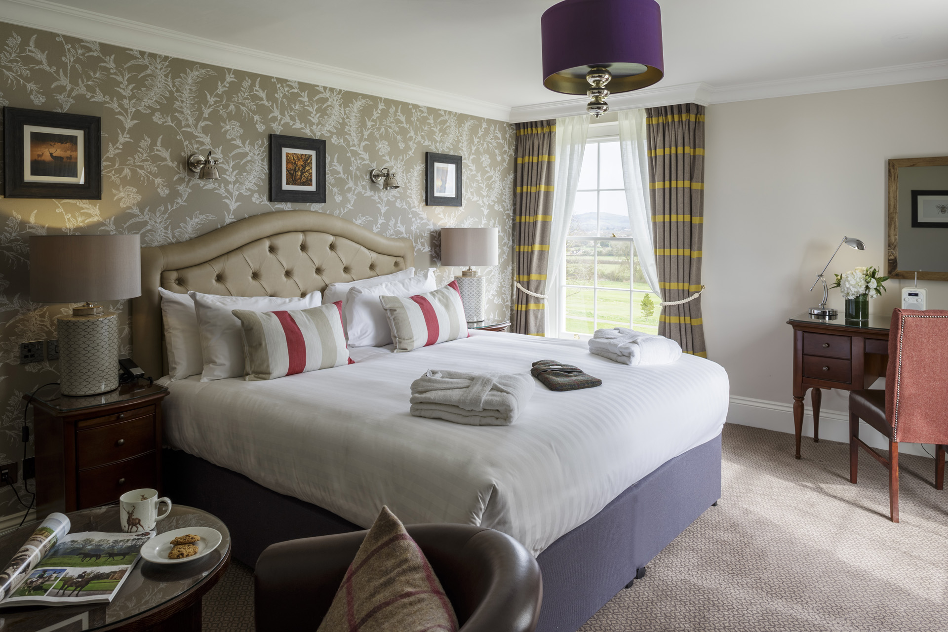 a bed in a historic suite at Tewkesbury Park