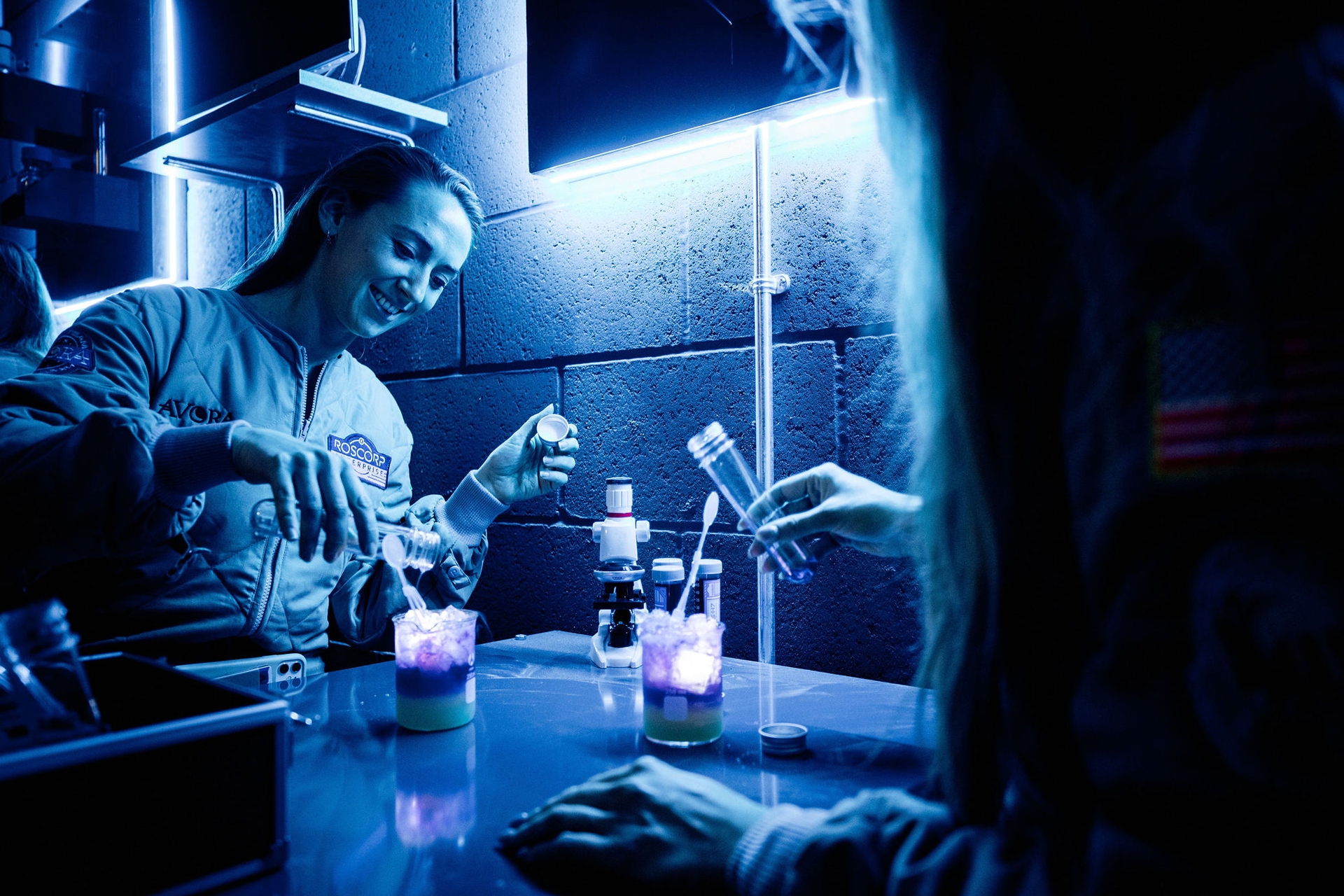 Woman making a cocktail at Avora, an immersive cocktail experience