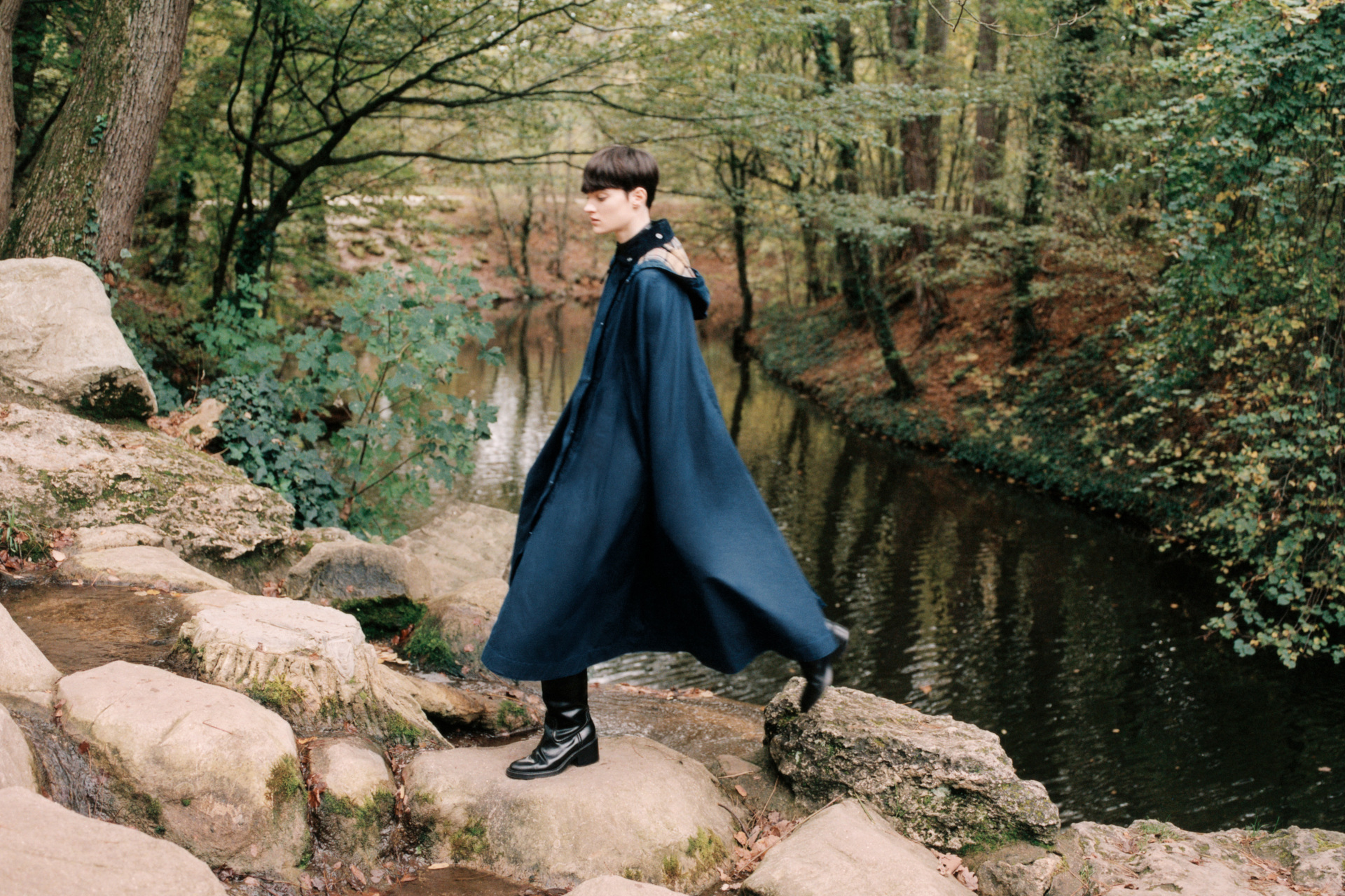 Woman walking through woods