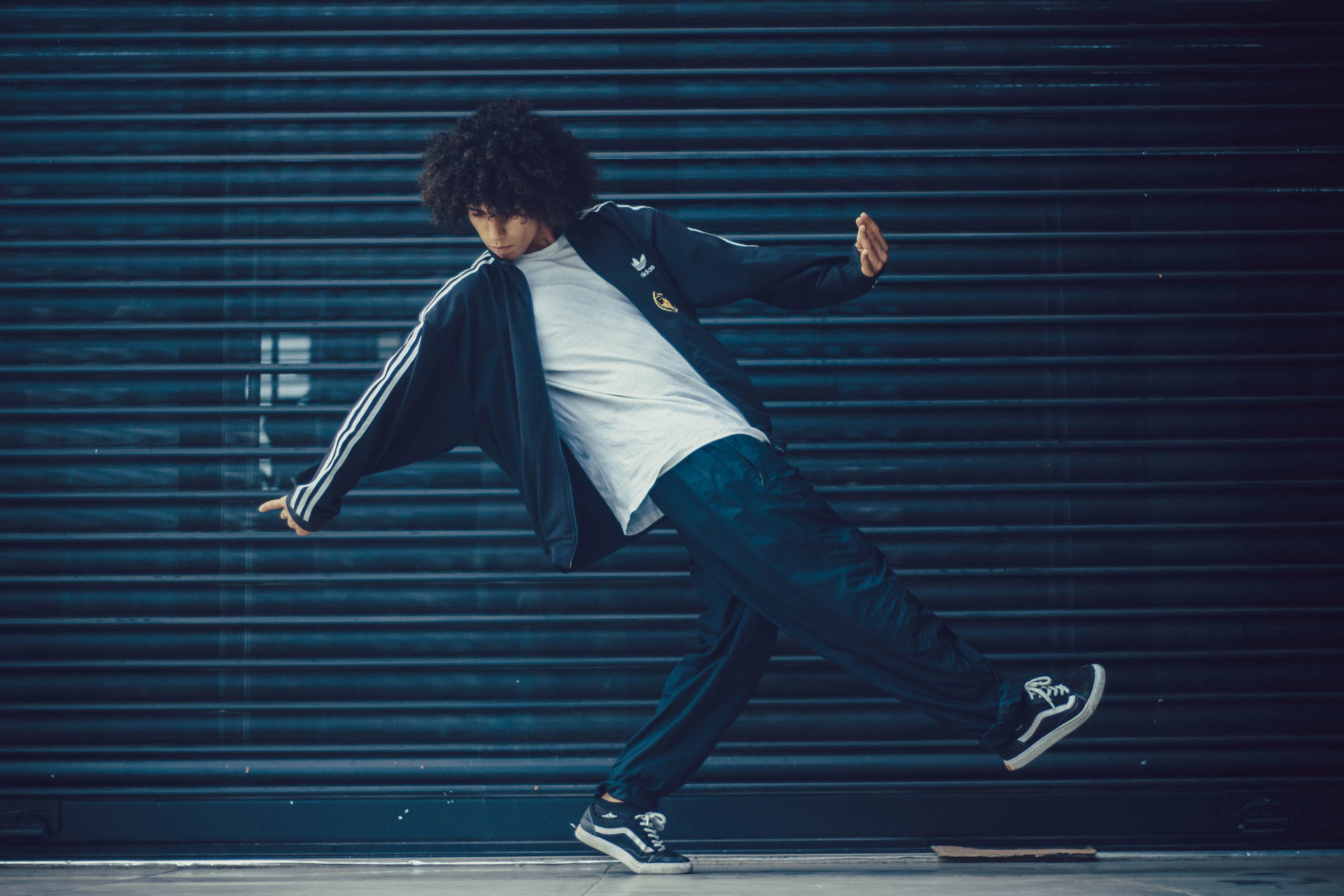 Man dancing in front of garage door