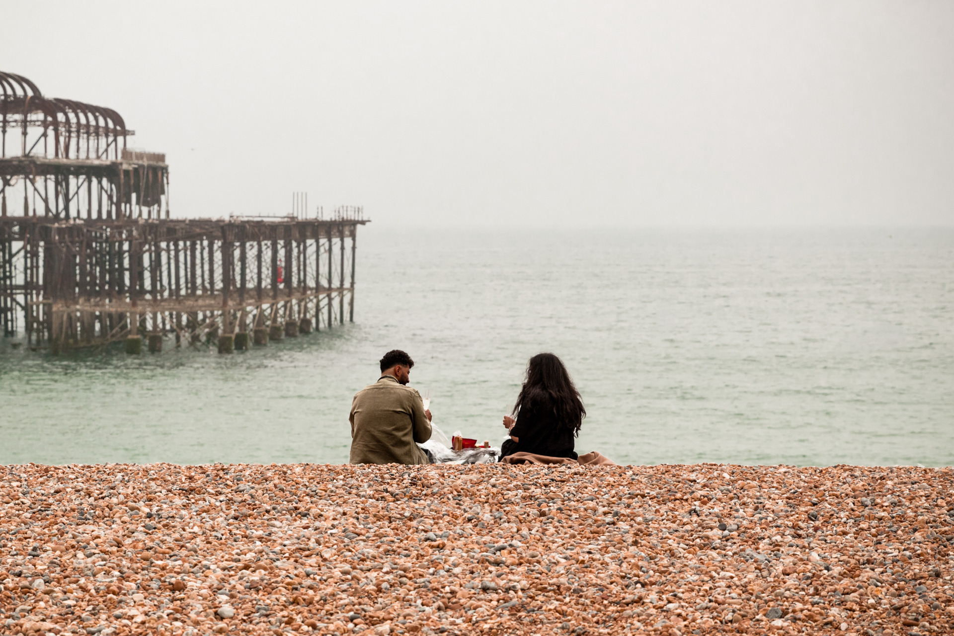 Couple sat on the beach