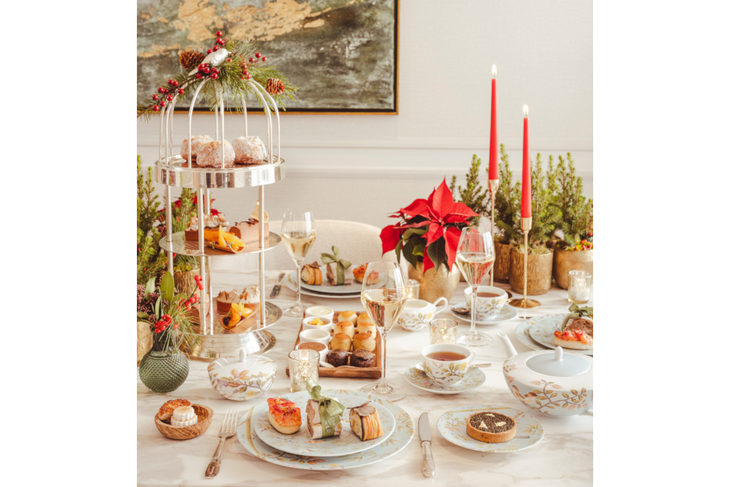 Afternoon tea laid out on white tablecloth-covered table