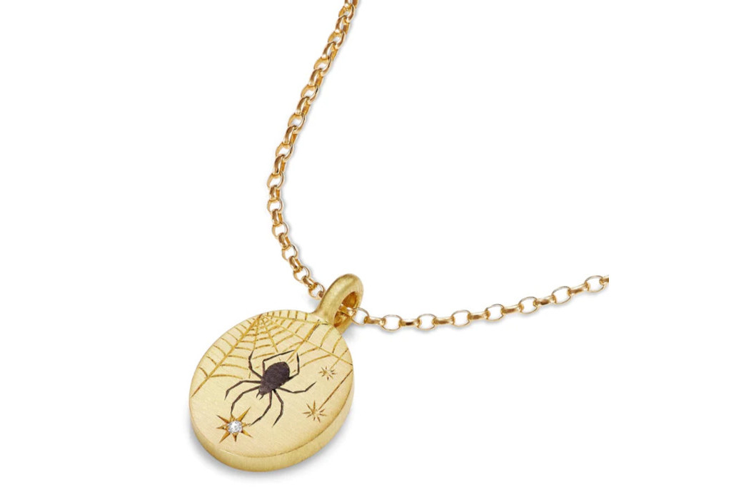Gold pendant with black spider
