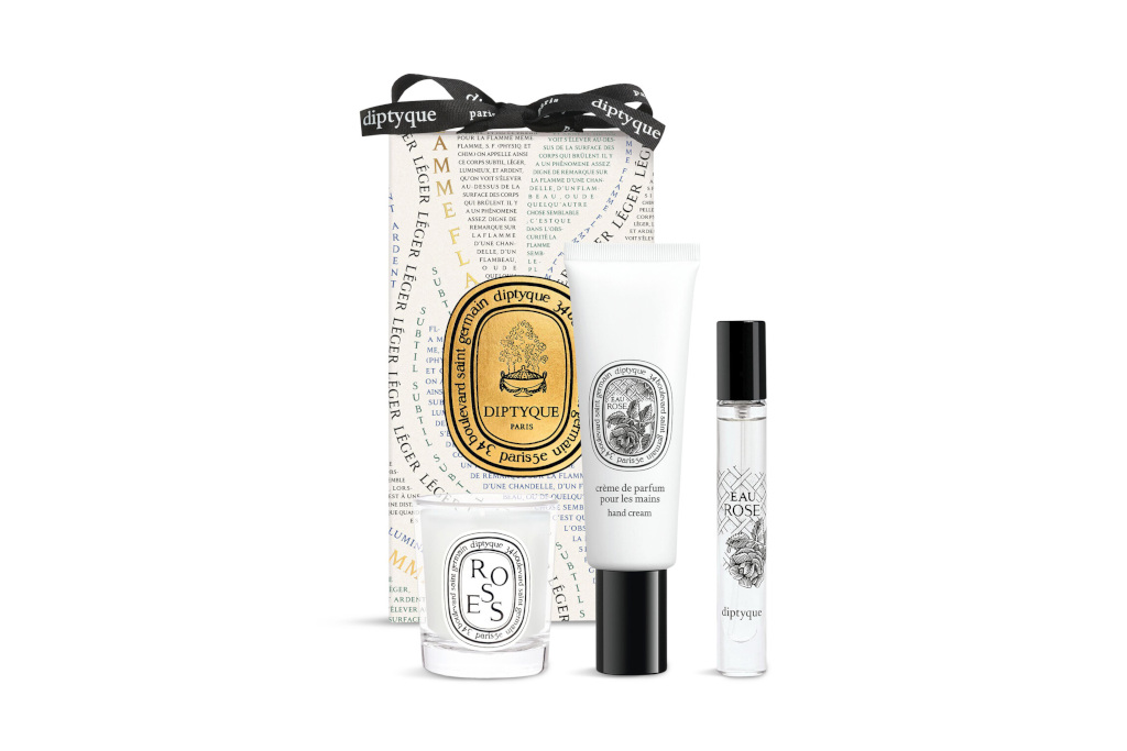 White and black box with candle and bottles