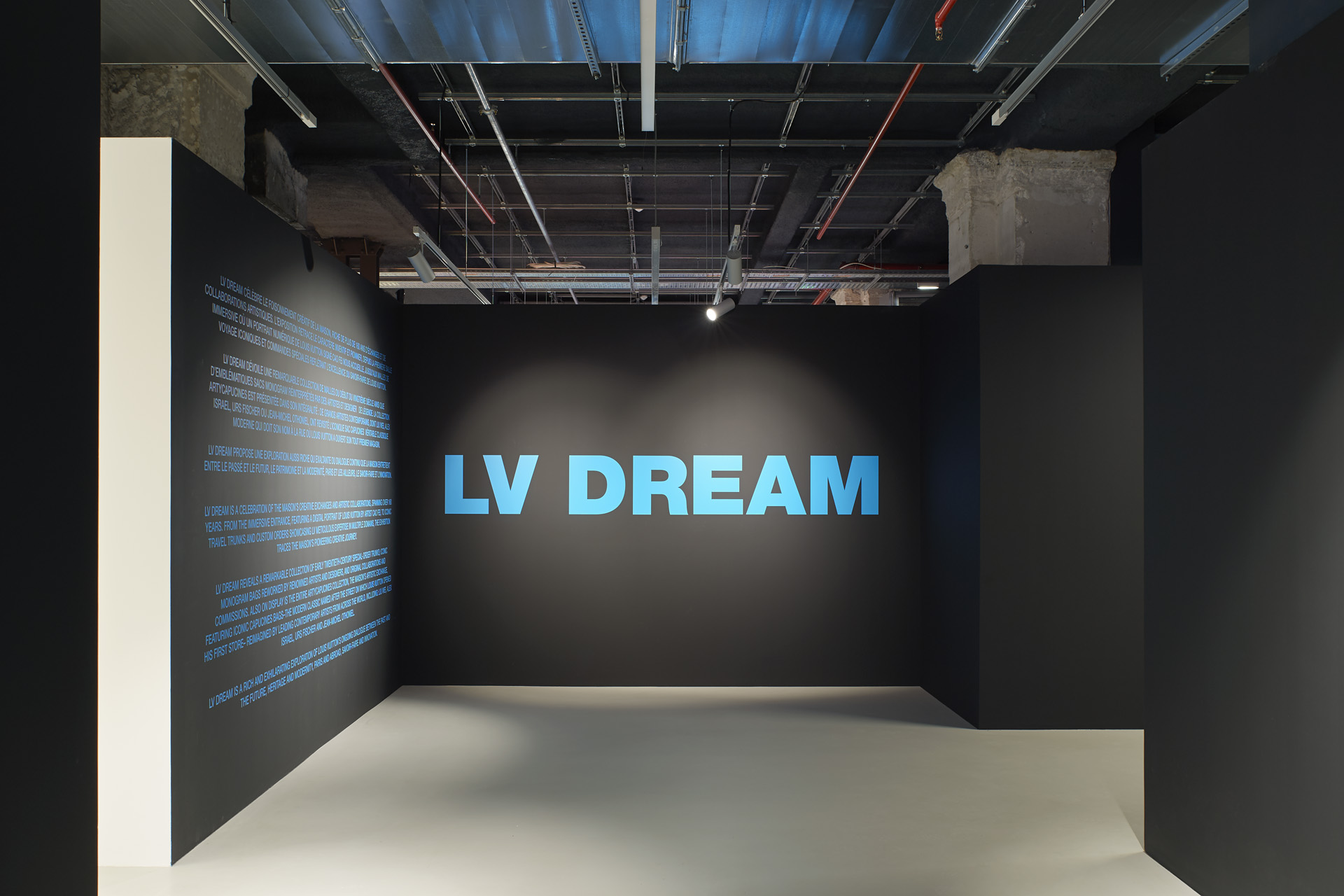 a black wall with 'LV Dream' in blue writing