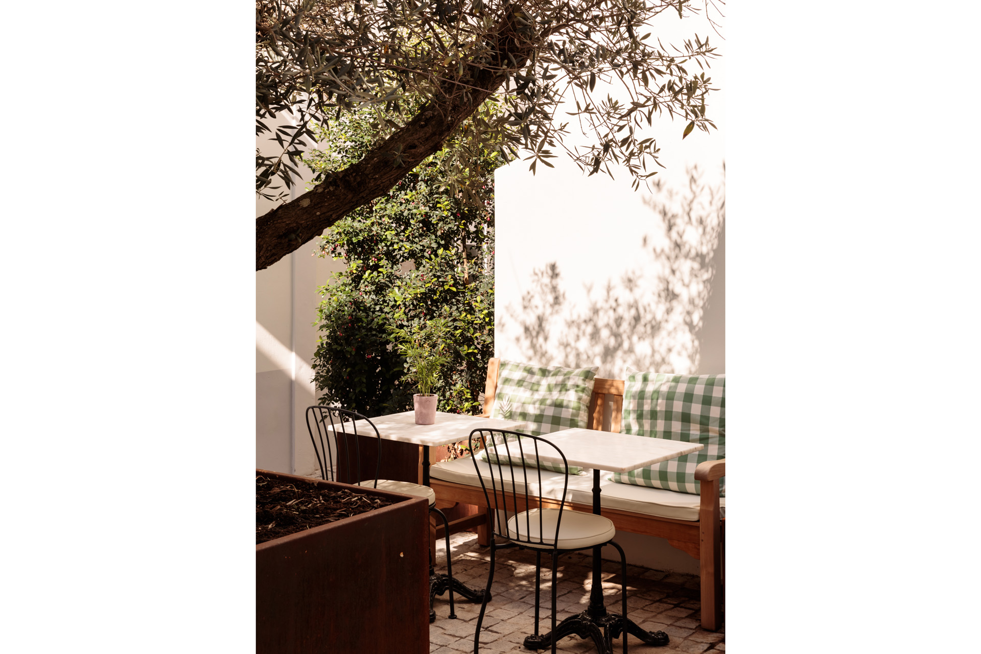 a sitting area in dappled light