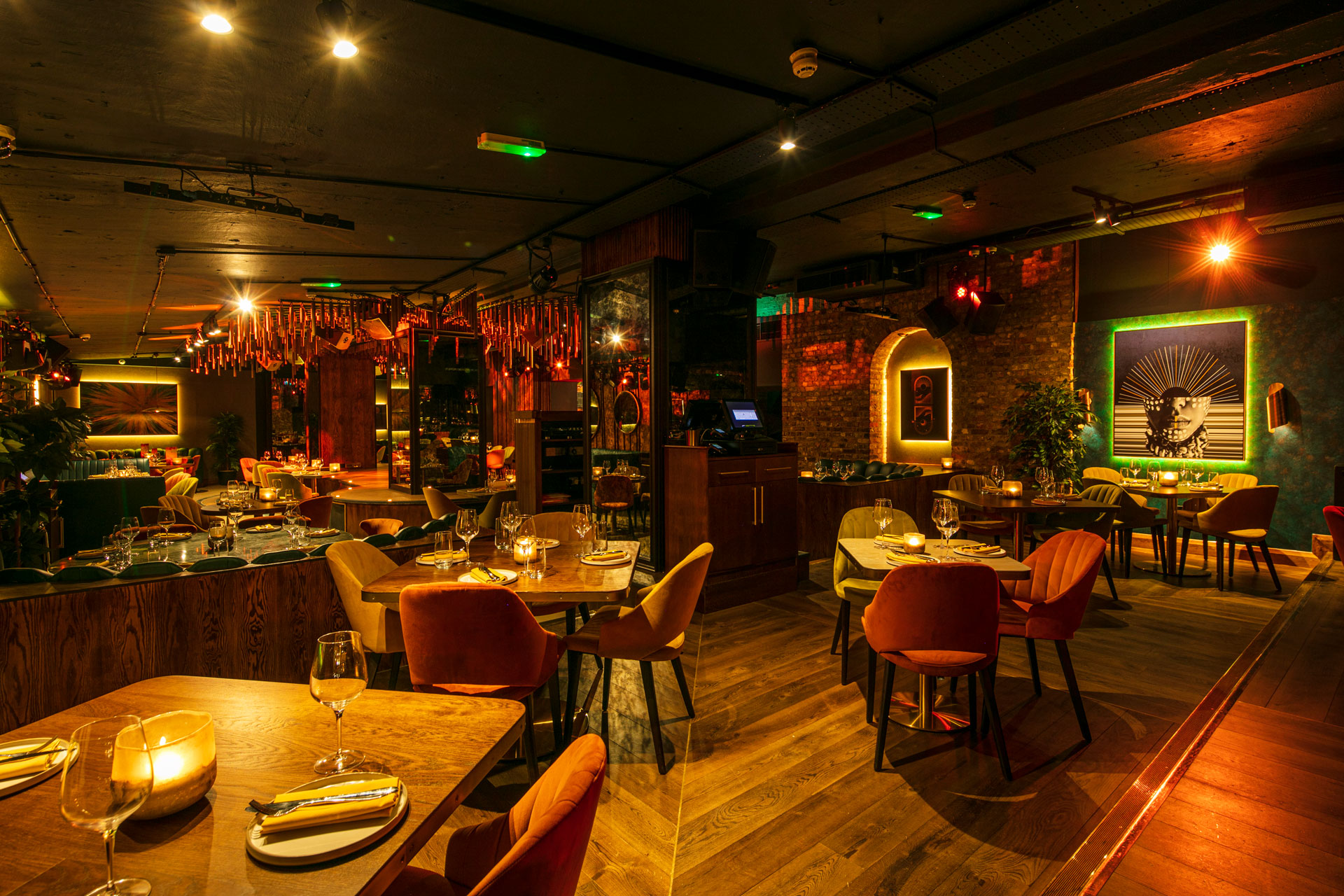 Inca restaurant tables and seats in low lit interior