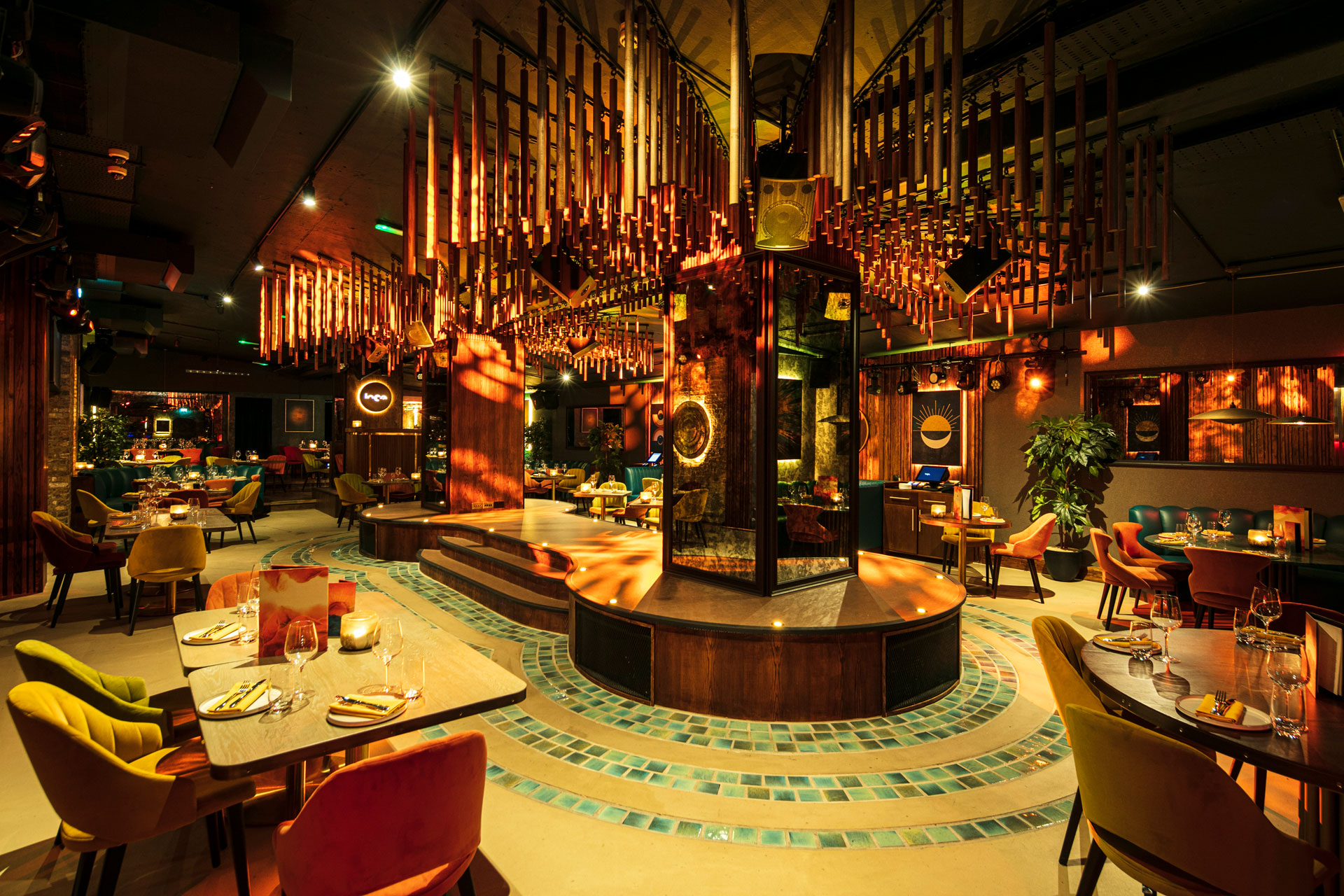 Inca Restaurant seating and tables under low lit scenery 