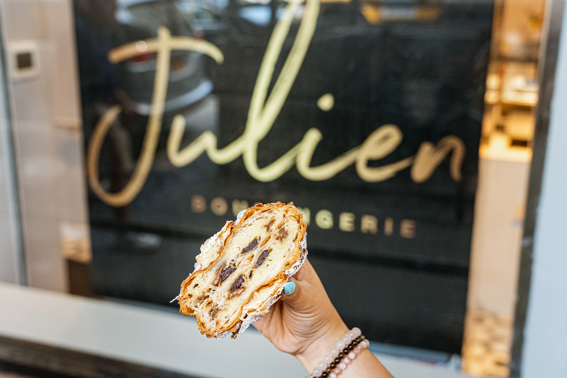 a pastry in front of a shop window in Brooklyn