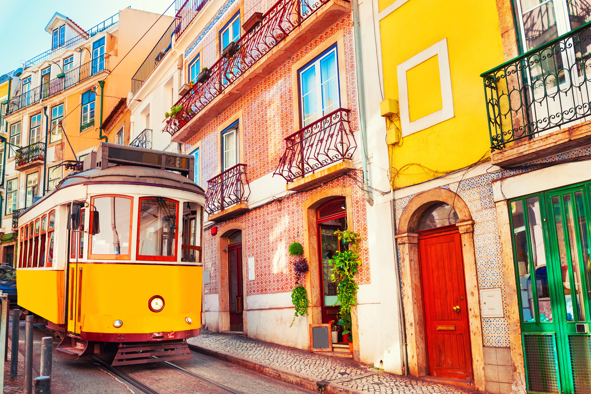 Yellow vintage tram on the street in Lisbon, Portugal