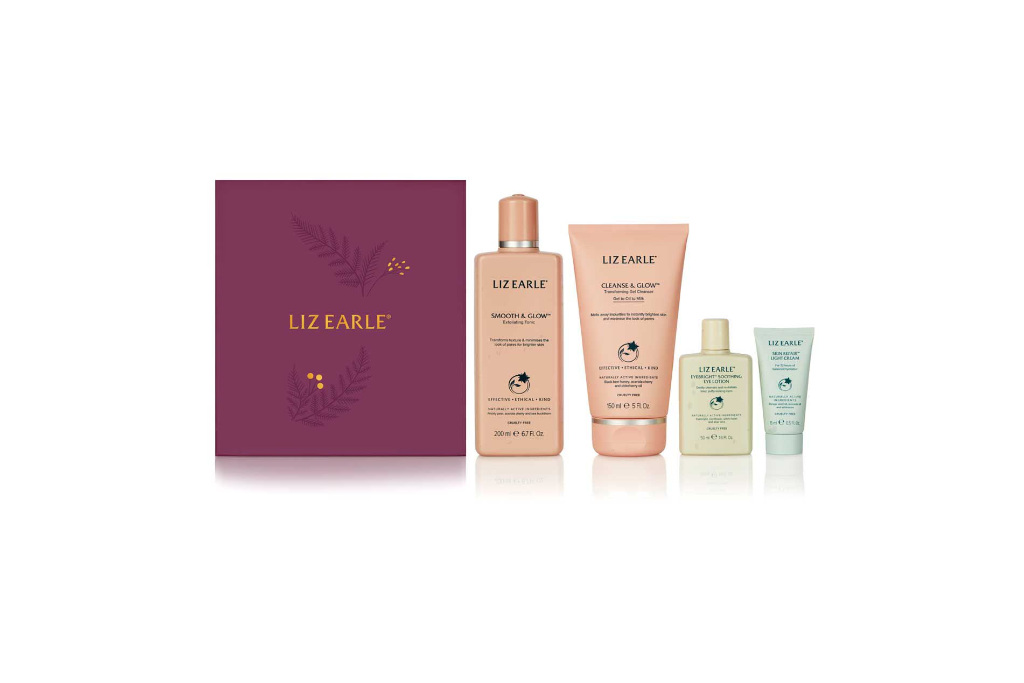 Liz Earle bottles next to purple box - Christmas beauty gifts