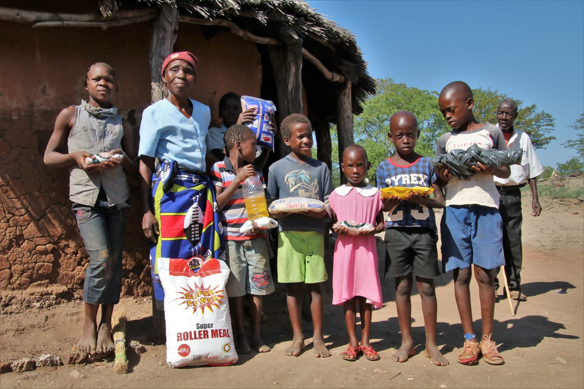 a group of Black children with a woman