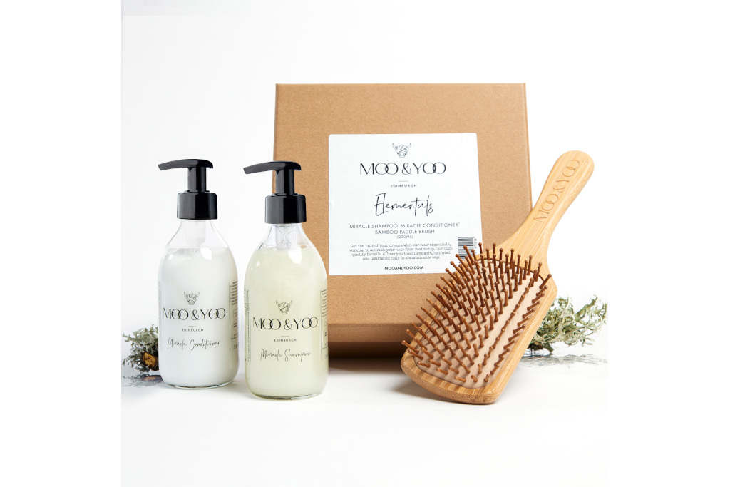 Bottles next to box and hair brush