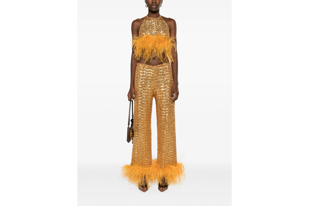 Woman in gold sequin co-ord